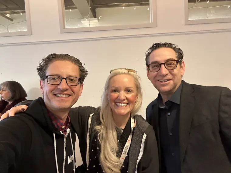 Jordan Isenstadt with two guests in the cafe