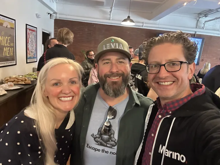 Jordan Isenstadt with two guests, one in a Levia cap