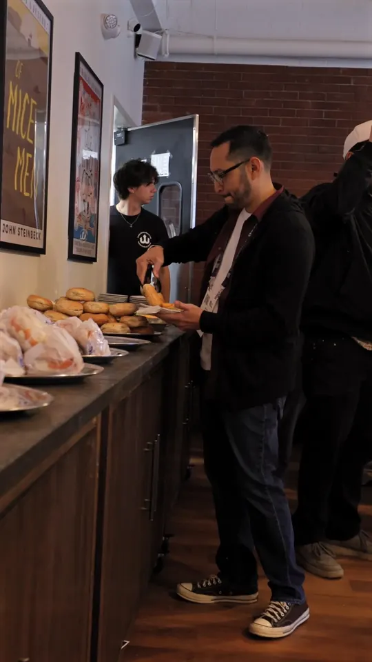 Guests lining up at the counter for bagels