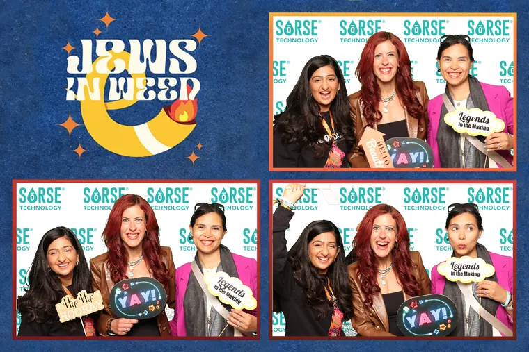 Photo booth strip of four women with props and signs