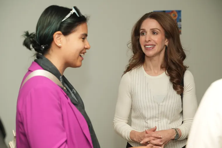 Two attendees chatting