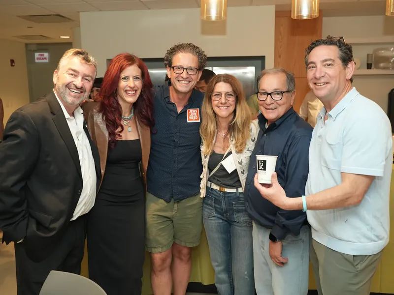 Six friends posing together at the IgniteIt Chicago Bagel Bash