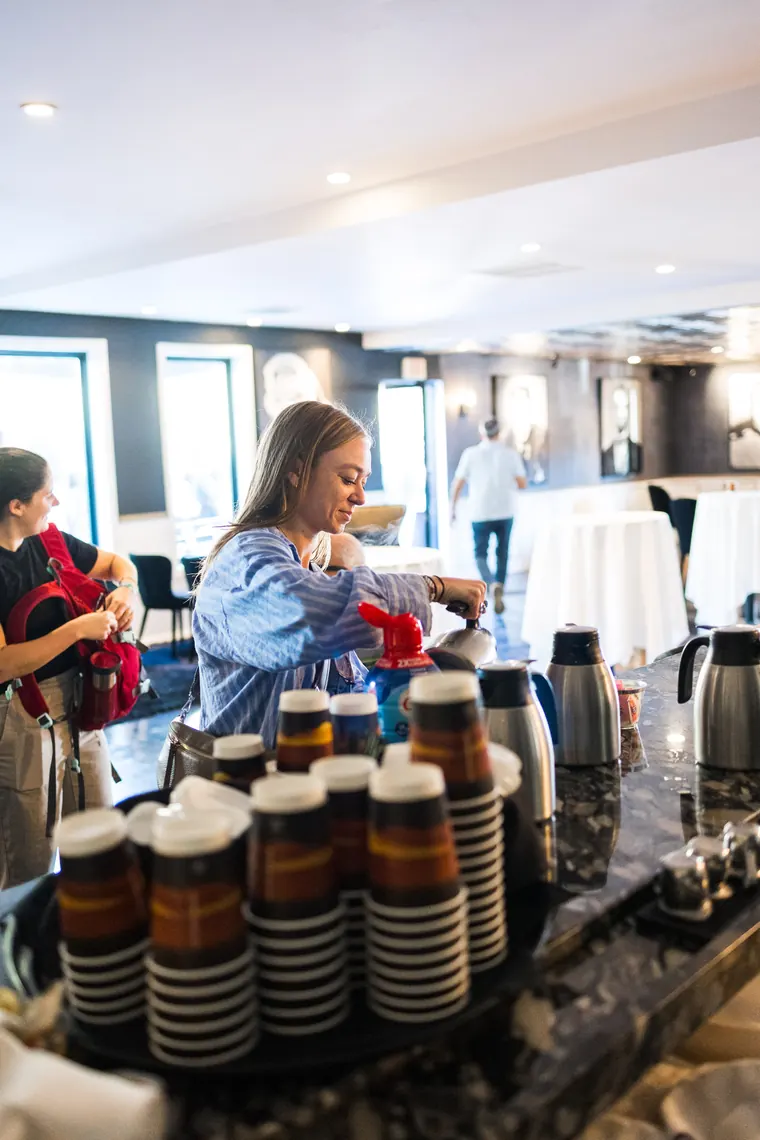 Coffee station stacked with striped paper cups