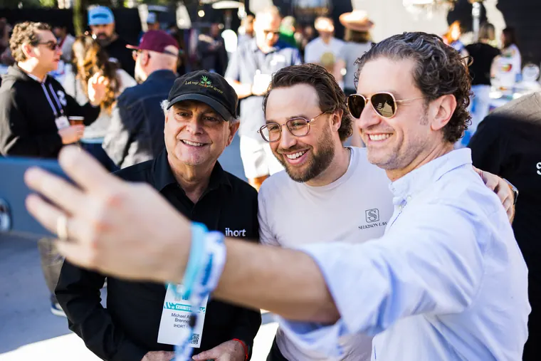 Three guests leaning in for a selfie