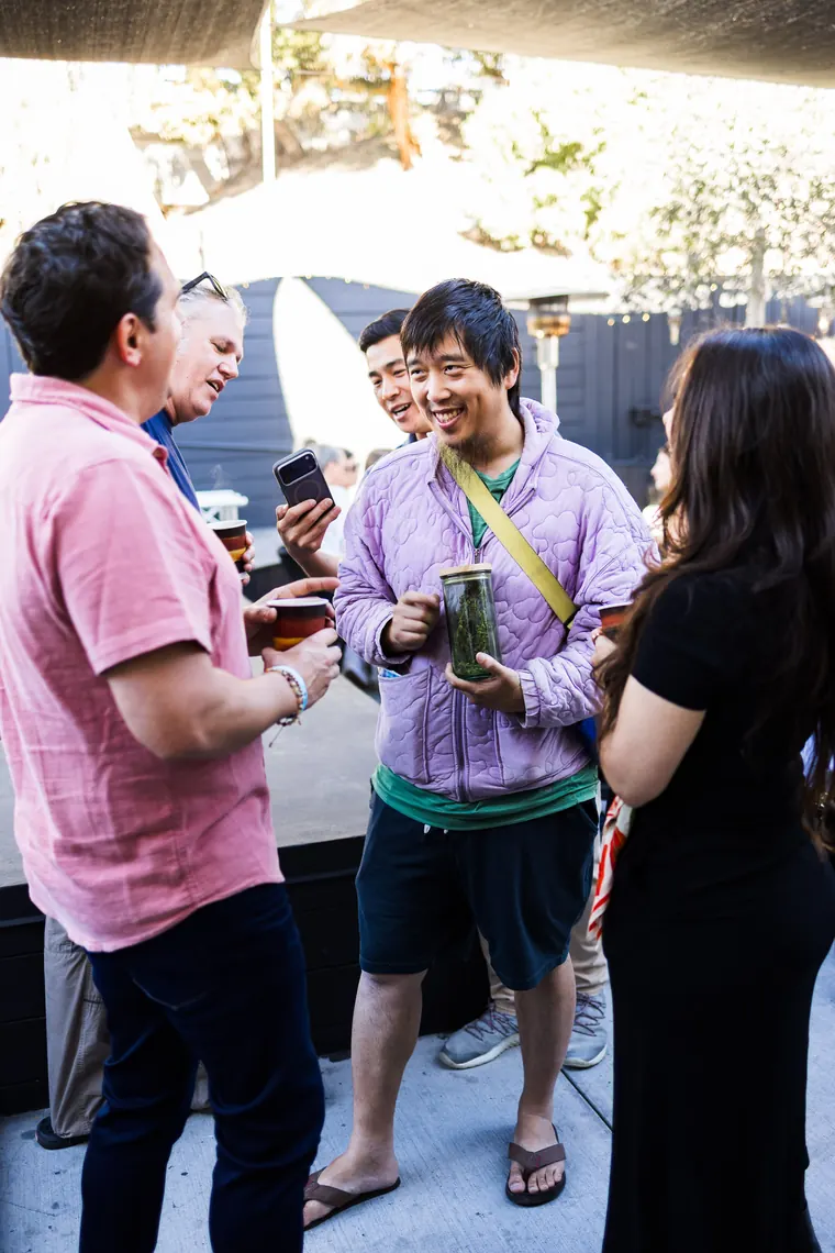 Group laughing together in the sunshine