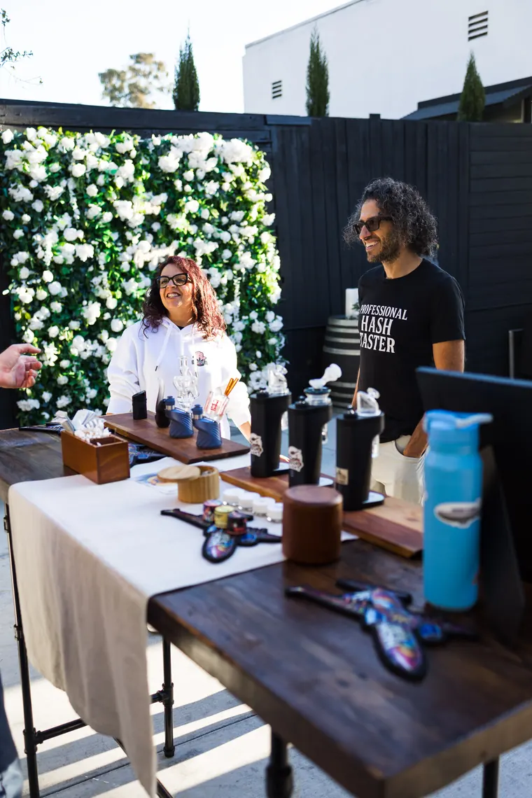 Exhibitor table on the patio with glassware and a tumbler