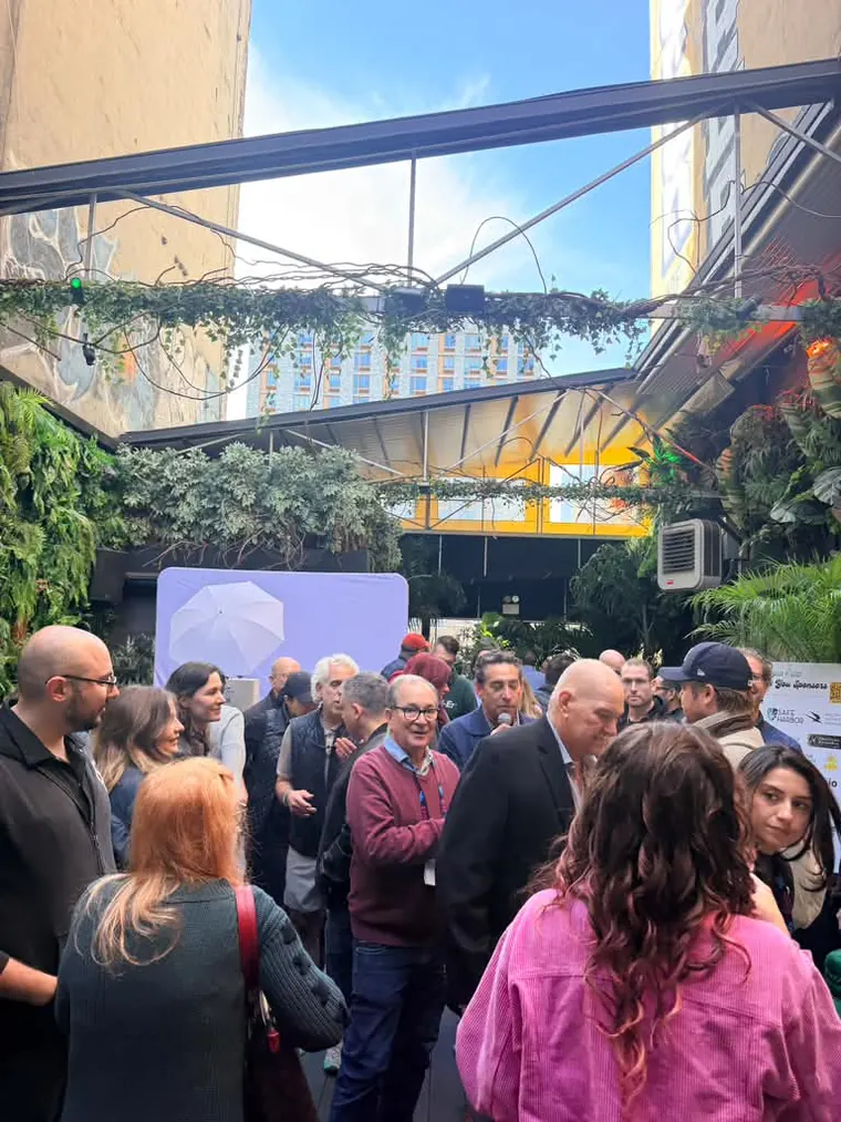 The crowd filling the rooftop under its retractable roof