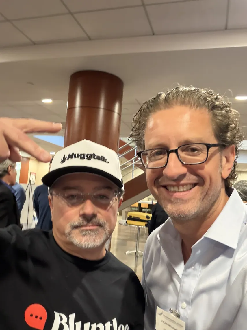 Jordan Isenstadt with a guest in a Nuggtalk cap