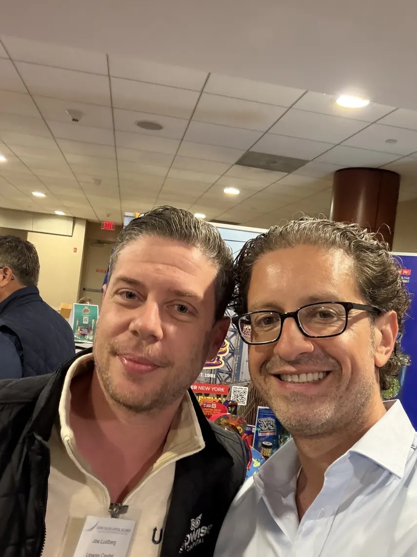 Jordan Isenstadt with an attendee in a close-up selfie